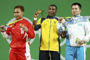 2016 Rio Olympics - Weightlifting - Men's 69kg Victory Ceremony - Riocentro - Pavilion 2 - Rio de Janeiro, Brazil - 08/08/2016. Oscar Figueroa (COL) of Colombia, Eko Yuli Irawan (INA) of Indonesia, and Farkhad Kharki (KAZ) of Kazakhstan pose with their medals. REUTERS/Yves Herman FOR EDITORIAL USE ONLY. NOT FOR SALE FOR MARKETING OR ADVERTISING CAMPAIGNS.