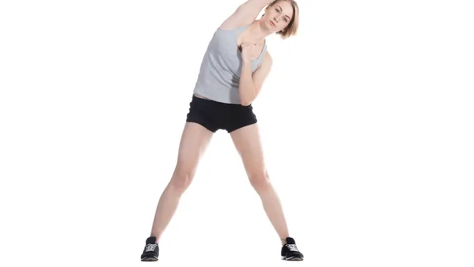 043938400_1775631859-sportswoman-stretching-her-right-arm
